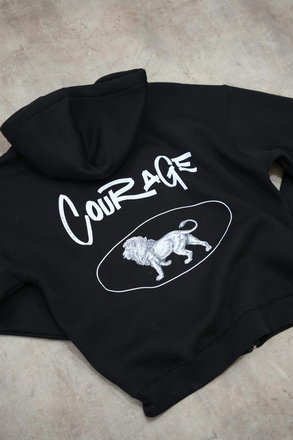 Black zip-up hoodie with a clean, premium streetwear aesthetic.