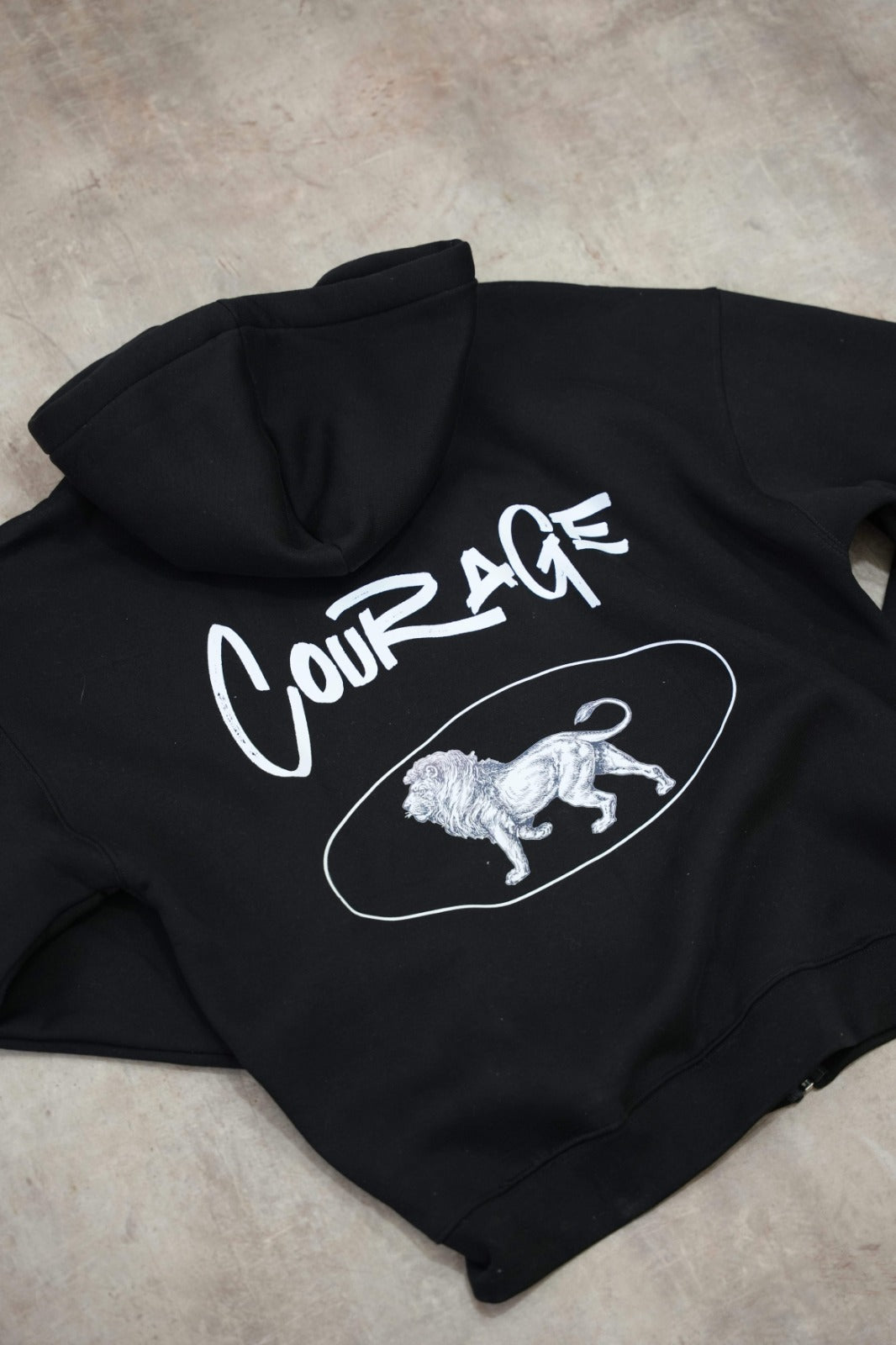 Black zip-up hoodie with a clean, premium streetwear aesthetic.