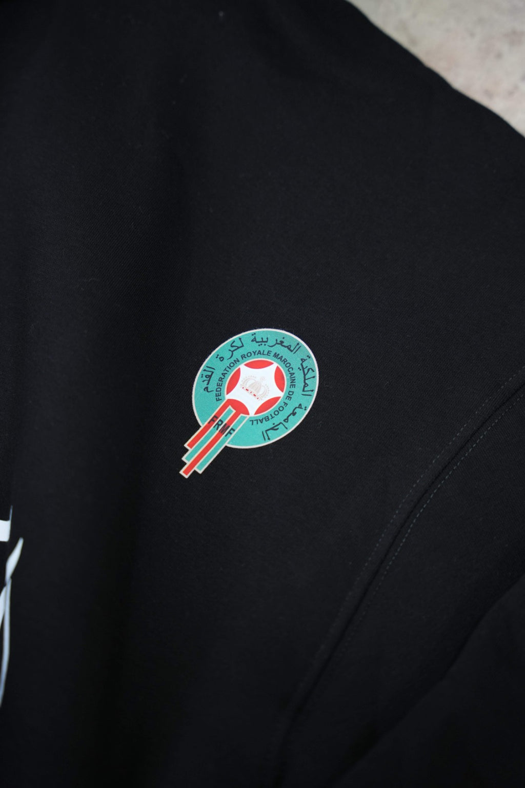 Black zip-up hoodie with a clean, premium streetwear aesthetic.