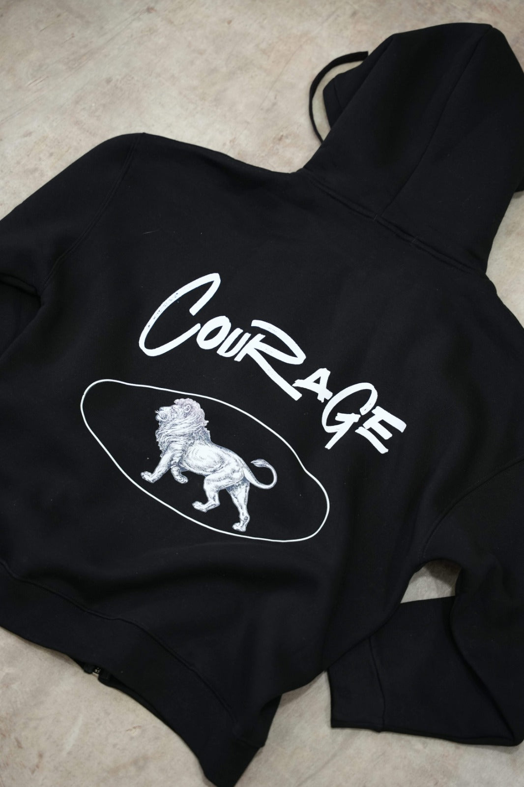 Black zip-up hoodie with a clean, premium streetwear aesthetic.