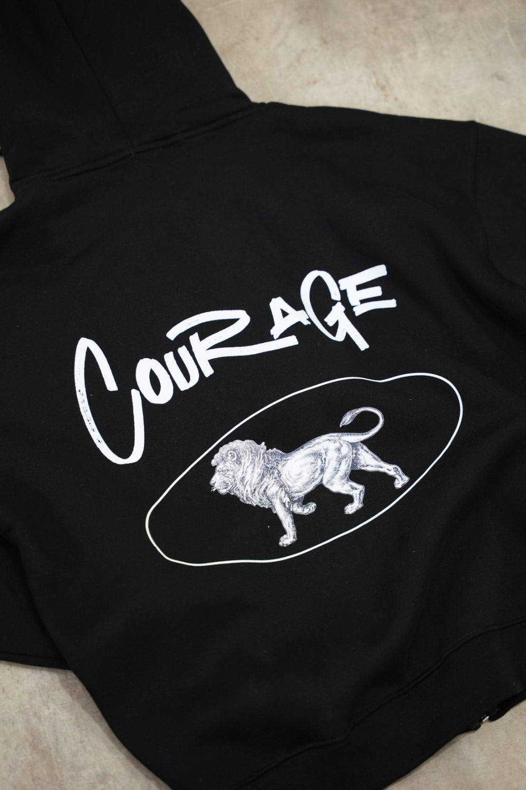 Black zip-up hoodie with a clean, premium streetwear aesthetic.