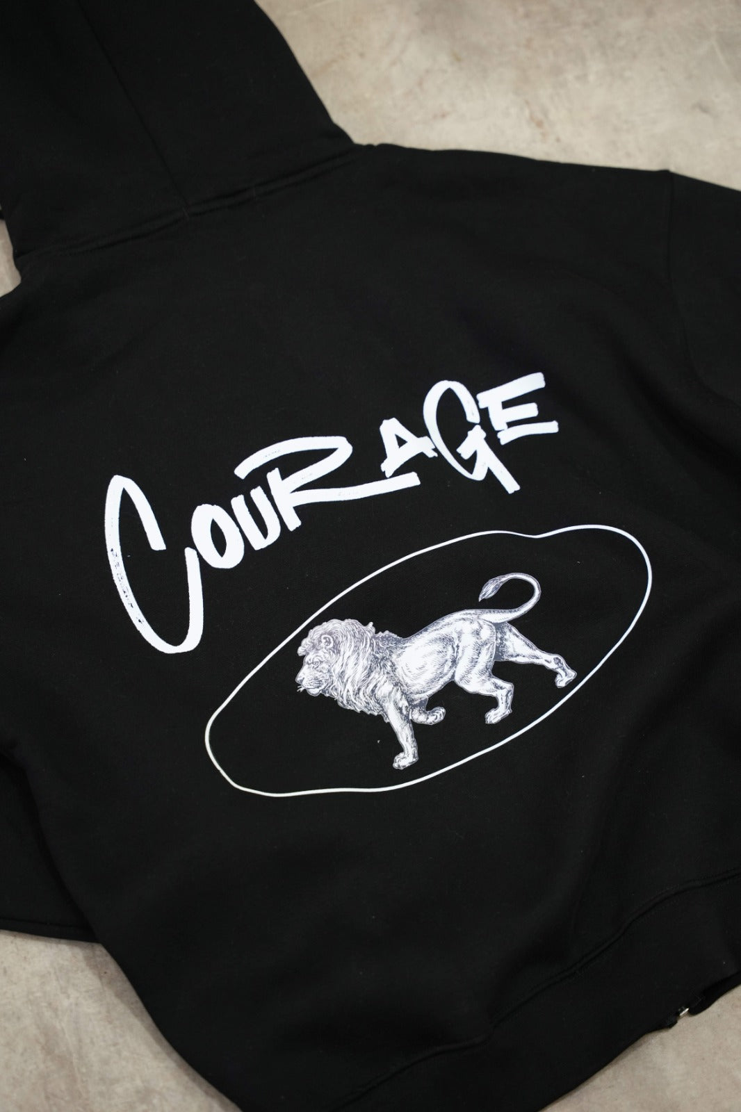 Black zip-up hoodie with a clean, premium streetwear aesthetic.