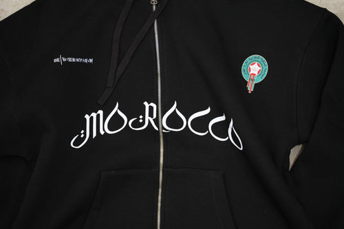 Black zip-up hoodie with a clean, premium streetwear aesthetic.